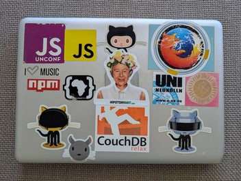 A Macbook Pro with plenty of stickers
