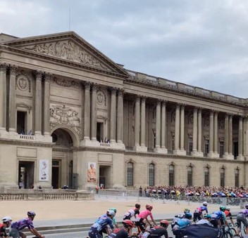 Tour de France riders entering the Louvre courtyard